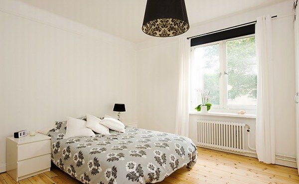 apartment with light wood floors painted white walls 7 554x3 30 Beautiful & Modern Swedish Bedroom Designs