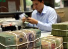 Có thể giao NHTM Nhà nước mua lại phần vốn của các Tập đoàn tại các NHTM